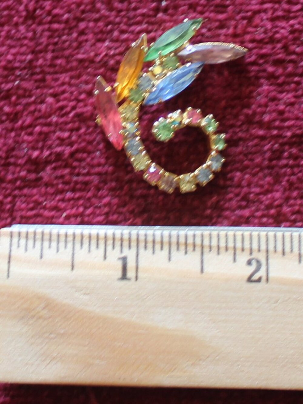 Vintage gold-tone multi-color rhinestone swirl brooch